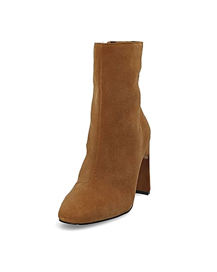 360 degree animation of product Beige suede heeled ankle boot frame-23