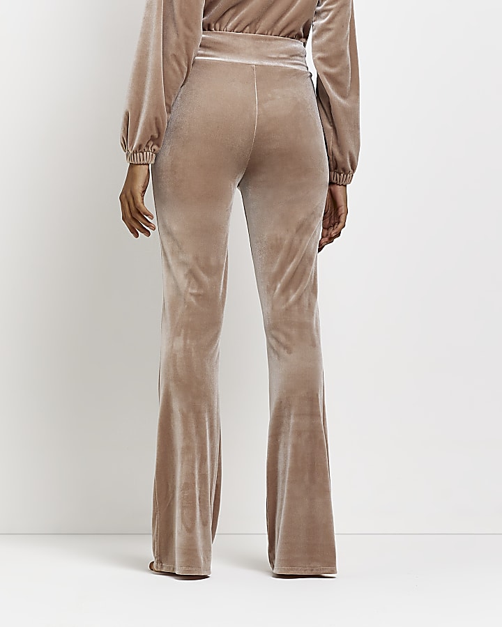 Beige velour flare trousers