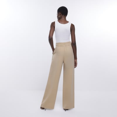 Beige wide leg pleated trousers | River Island