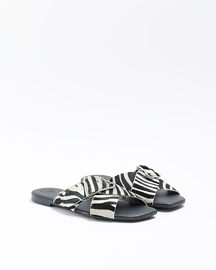 Black animal print flat sandals