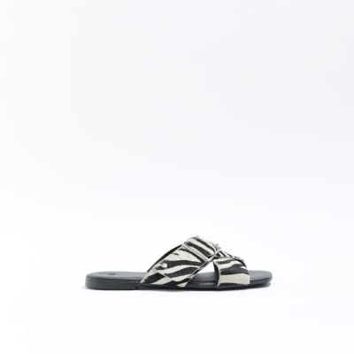 Black animal print flat sandals River Island