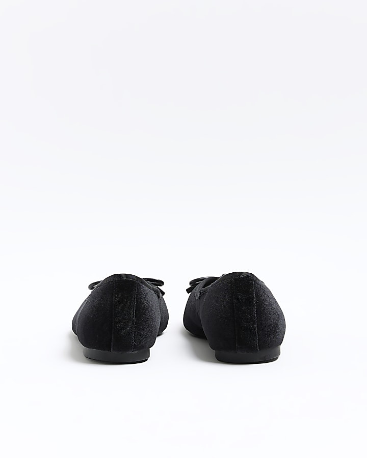 Black bow ballet shoes