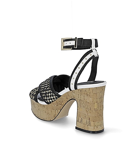 360 degree animation of product Black buckle platform heels frame-6