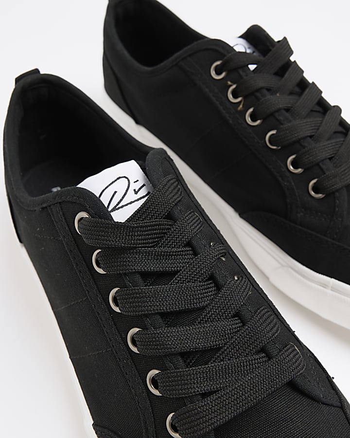 Black canvas lace up trainers