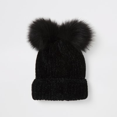 black wooly hat with fur pom pom