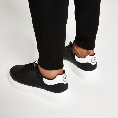 thick sole black trainers