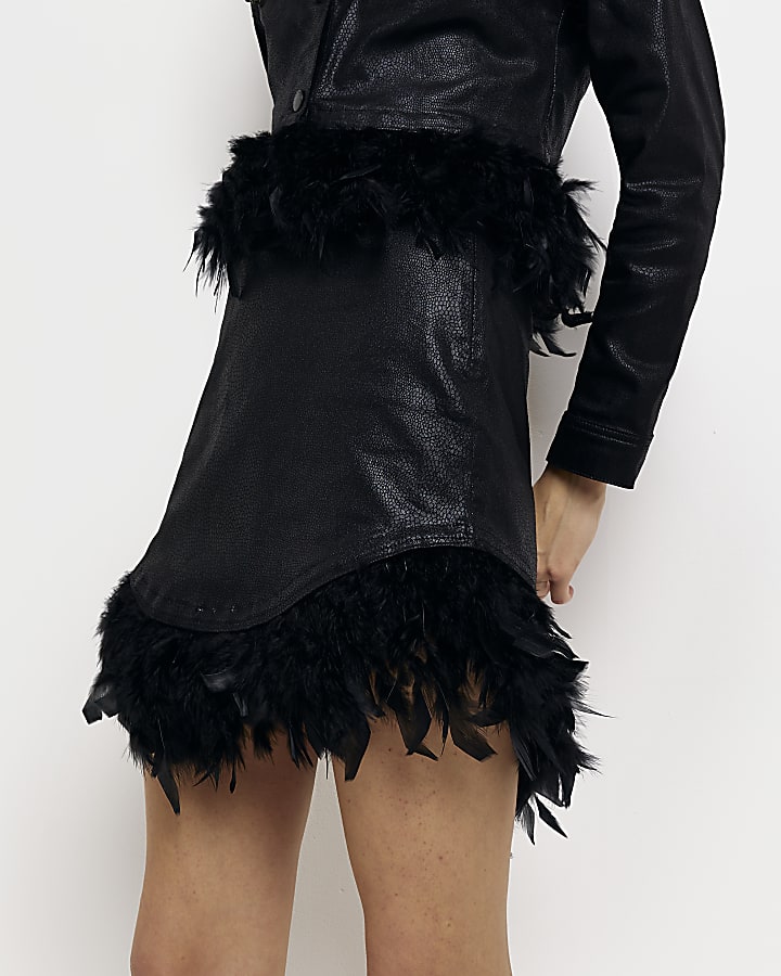 Black coated denim feather mini skirt