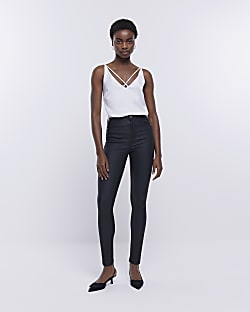 Black coated denim high waisted skinny jeans