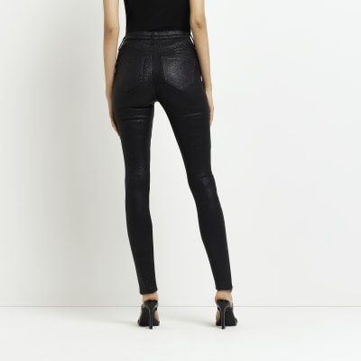 Black coated high waisted skinny jeans | River Island