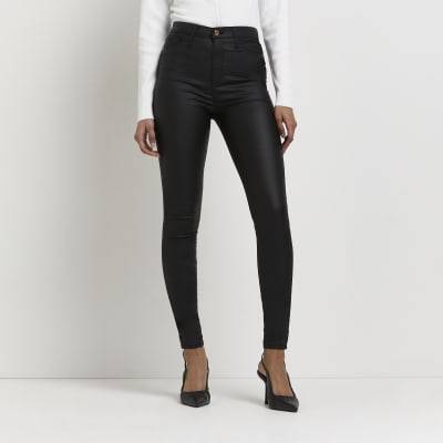 Black coated high waisted skinny jeans | River Island