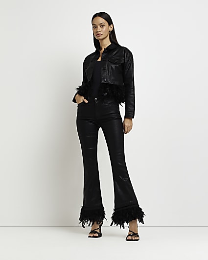 Black coated mid rise feather flared jeans
