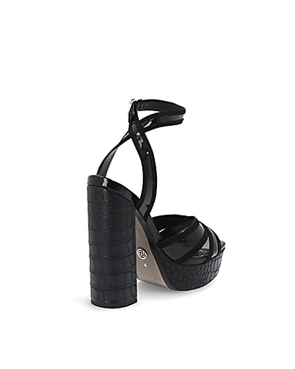 360 degree animation of product Black croc embossed strap platform heels frame-12