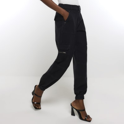 Black cuffed cargo jeans River Island