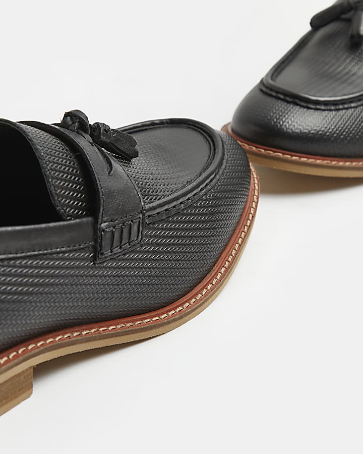 Black embossed leather tassel loafers