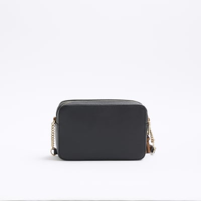 Black embossed RI boxy cross body bag | River Island