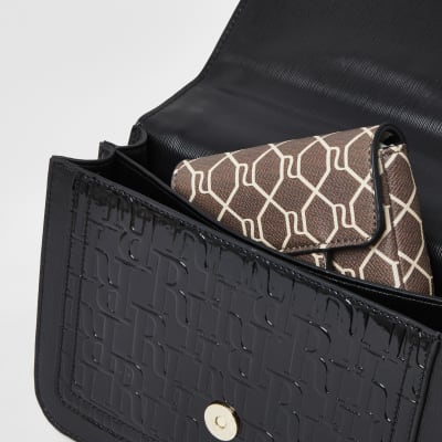 Black embossed satchel with detachable pouch