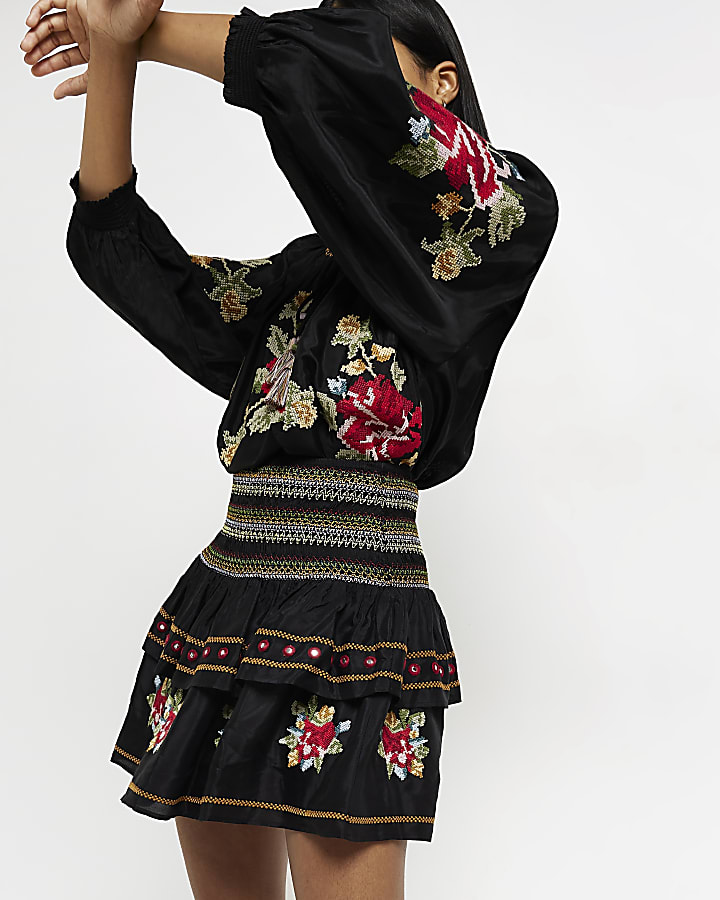 Black embroidered mini skirt