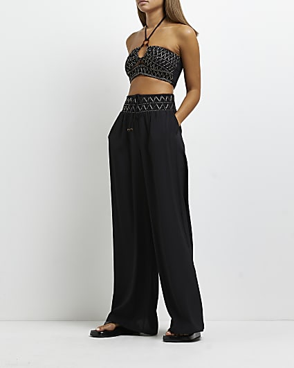 Black embroidered wide leg trousers