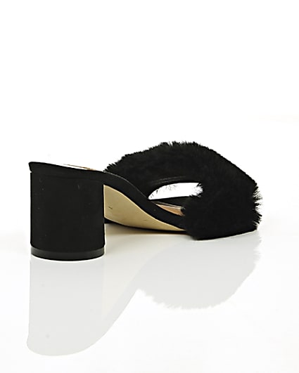 360 degree animation of product Black faux fur block heel mules frame-13