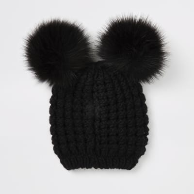 black hat with black pom pom