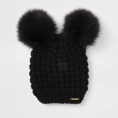 black hat with fur pom pom