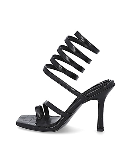 360 degree animation of product Black faux leather ankle wrap heels frame-4
