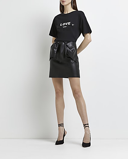 Black faux leather bow detail mini skirt