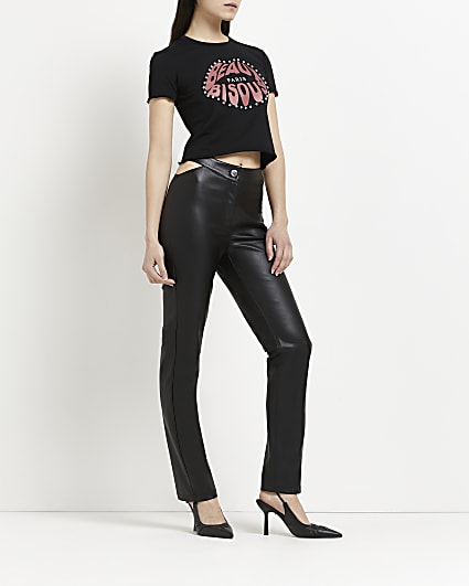 Black faux leather cut out flared trousers