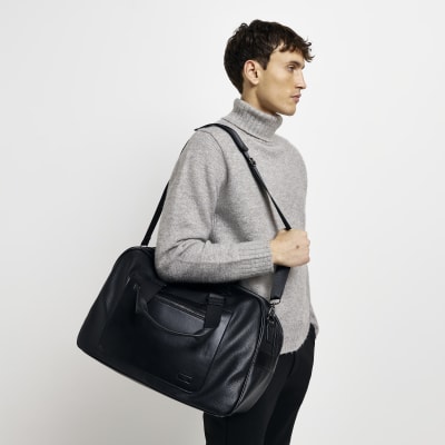 Black faux leather holdall River Island