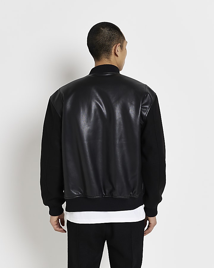 Black faux leather long sleeve varsity jacket