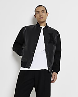 Black faux leather long sleeve varsity jacket