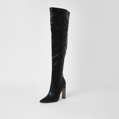 Black faux leather pull on high leg boots