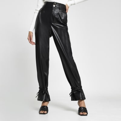 Black faux leather tie bottom trousers