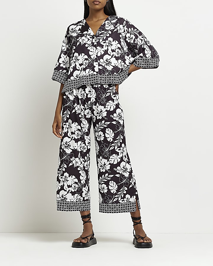 Black floral cropped wide leg trousers