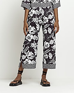 Black floral cropped wide leg trousers