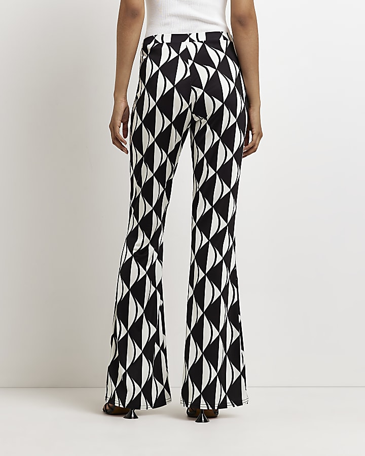 Black geometric print flared trousers