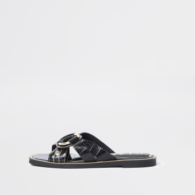 black sandals with gold buckle