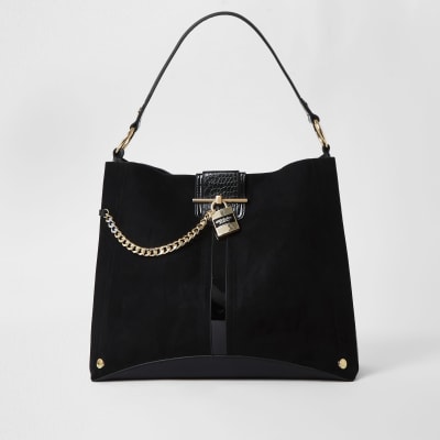 black bag with chunky gold chain