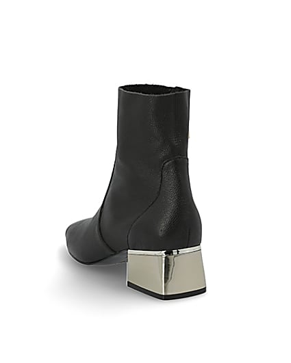 360 degree animation of product Black gold tone block heel boots frame-7