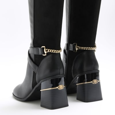 high rise black boots