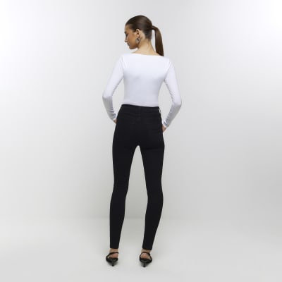 Women's black rock skinny trousers, visible press studs