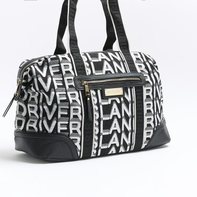 Black jacquard RI monogram travel bag River Island