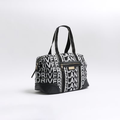 Black jacquard RI monogram travel bag River Island