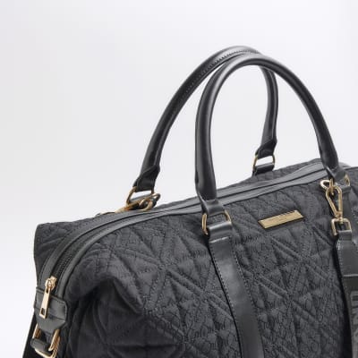 Black jacquard RI monogram travel bag River Island