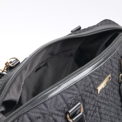 Black jacquard RI monogram travel bag River Island