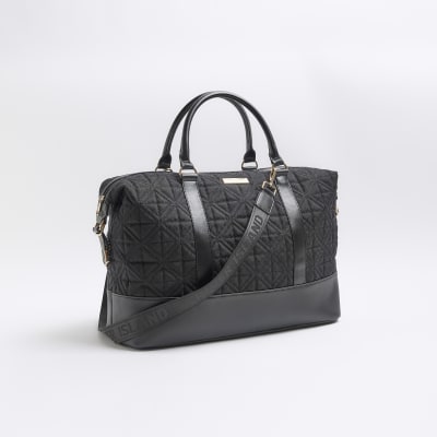 Black jacquard RI monogram travel bag River Island