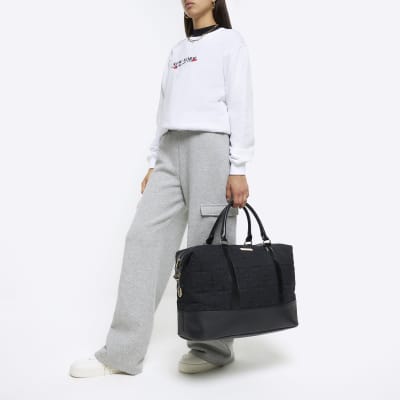 Black jacquard RI monogram travel bag River Island