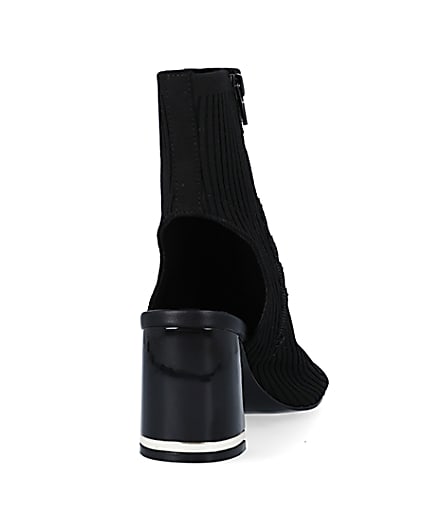 360 degree animation of product Black knit heeled ankle boots frame-10