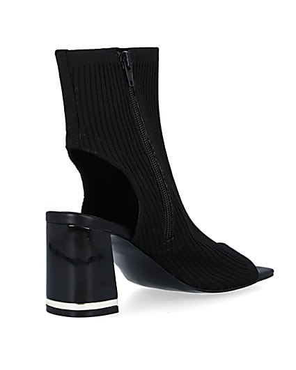 360 degree animation of product Black knit heeled ankle boots frame-12