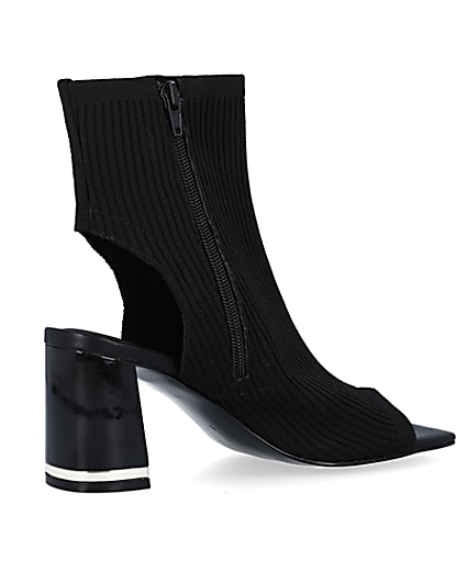 360 degree animation of product Black knit heeled ankle boots frame-13